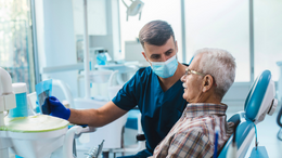 Dentist consulting with patient