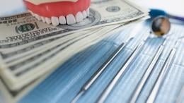 Teeth, money, and dental tools